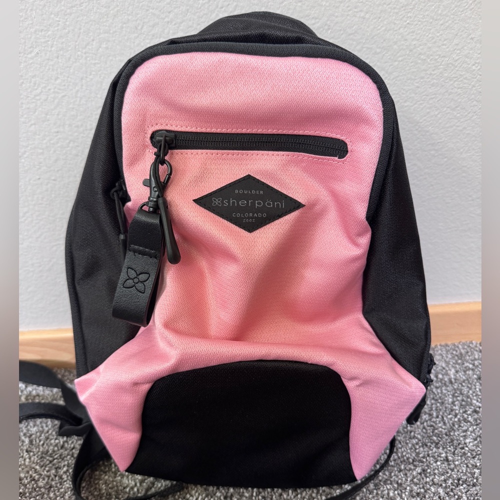 Sherpani mini backpack. Pink and Black. NWT